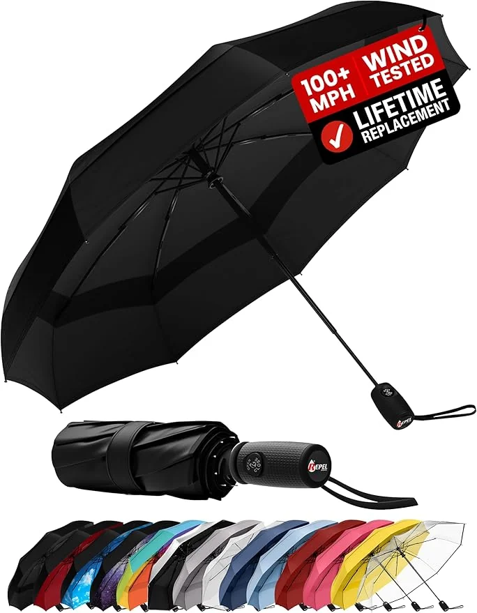 Compact travel umbrella open in an afternoon rain shower on a city street