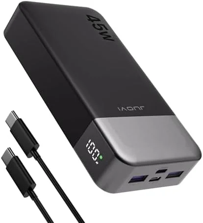 Anker PowerCore power bank charging a phone in a car cupholder on a road trip