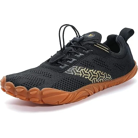 Trail running shoes on a rocky, root-covered hiking trail in the Southern Appalachians