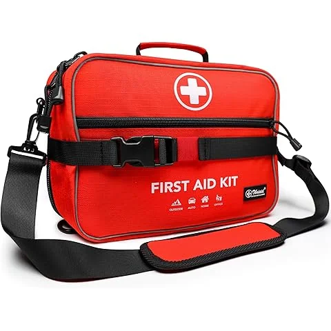 Compact hiking first aid kit open on a rock at a trail rest stop